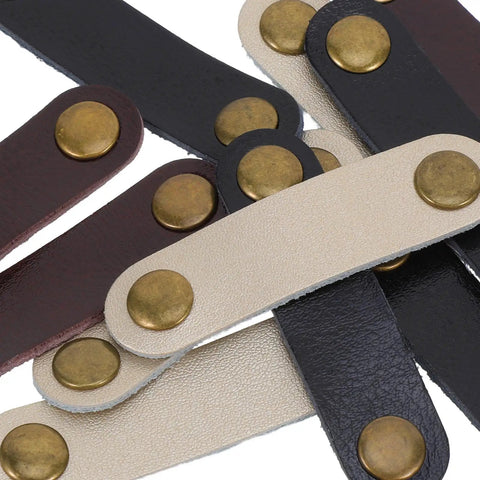 Get These Hella Sturdy Leather Cord Organizers 12 Piece Set With Secure Snap Closures showing durable leather straps with bronze snaps.