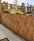 Reed Fencing Rolls 6 Ft By 16.4 Ft Natural Reed Screen Curtain For Outdoor Privacy And Shade For Easy Setup In Your Backyard Vibes Patio Garden Brown Bamboo Fence Covering Eco Friendly Decorative Fence Mat installed on a balcony for privacy.