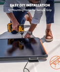 Man drilling SolarSaga 100 Prime Bifacial DIY Solar Panel 100W Portable Solar Charger for secure van or RV installation.