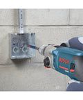 4-3/8 In Carbide SDS-Plus Speedcore Thin-Wall Core Bit drilling into concrete with rotary hammer in use
