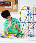 Roller Coaster Building Set With 546 Pieces And Motor Hands On STEM Toy For Ages 8 Plus Creative Building Kit For Solo Or Team Play Includes Ramp And Half Pipe Models boy building a multicolor plastic roller coaster
