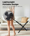Person carrying 16 Inch Pedestal Floor Fan With 90 Degree Oscillation Three Speed Settings Adjustable Height Keeps Your Room Cool All Day