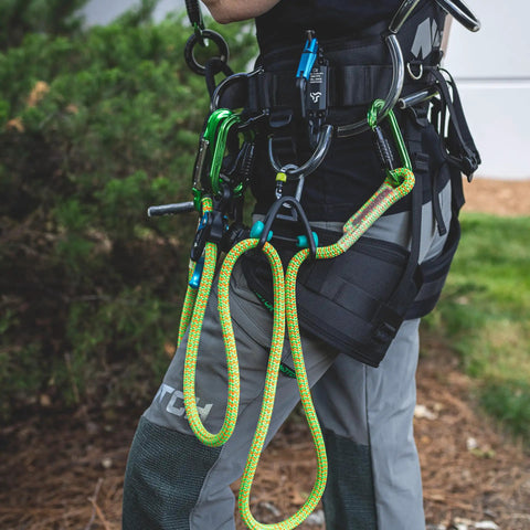 Harness with climbing gear using Sidekick Lanyard Manager auto adjusts to most lanyard diameters with one-handed operation 99563.