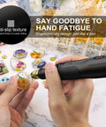 Close-up view of black LET'S RESIN cordless drill with gold chuck drilling resin jewelry pieces.