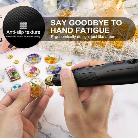 Close-up view of black LET'S RESIN cordless drill with gold chuck drilling resin jewelry pieces.
