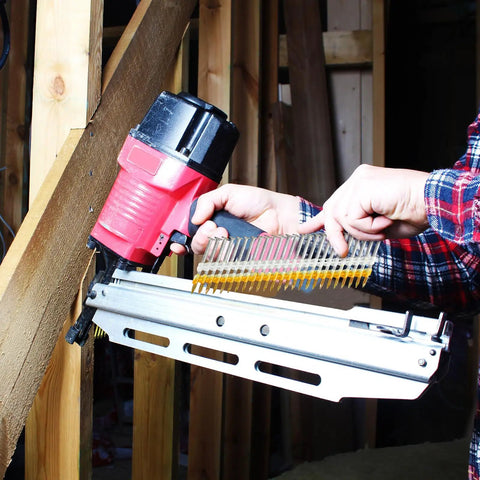 1000 Count 2 Inch Framing Nails With Ring Shank And Flat D Head 21 Degree Galvanized Plastic Collated Strip shown in pneumatic nailer.