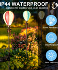 Colorful hot air balloon style solar lights in garden, IP44 waterproof rating, frost and weather resistant, Solar Pathway Lights Outdoor 4 Pack Hot Air Balloon Style Waterproof For Patio Garden Yard Walkway Fence Decor Auto On After Dark With Adjustable Heights And Easy Sun Powered Charging No Fuss Setup.