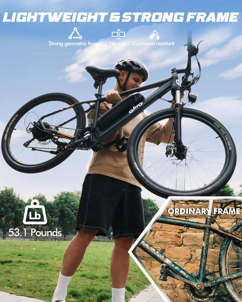 Man lifting Gnarly Urban Electric Mountain Bike For Adults And Teens with 28 MPH Peak, showcasing lightweight design.