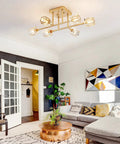 Modern living room featuring 6 Light Brushed Gold Semi Flush Mount Ceiling Light Fixture, glass shades, and geometric art.
