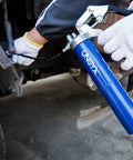 Mechanic using Heavy Duty Pistol Grip Grease Gun Kit 14oz Mini Grease Gun With 6000 PSI Leakproof Seal on automotive part