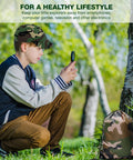 Child using a magnifying glass outdoors with camo backpack beside them, part of an Outdoor Adventure Kit For Kids With Walkie Talkies, Binoculars, And Magnifying Glass, Kid Friendly Explorer Gear For Camping, Hiking, And Backyard Fun, Creative And Educational Play Set For Boys And Girls.