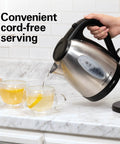 Electric Tea Kettle 1.7 Liter Cordless Boiler With 1500 Watts For Fast Boiling Auto Shutoff And Boil Dry Protection Stainless Steel being used to pour hot water into cups.
