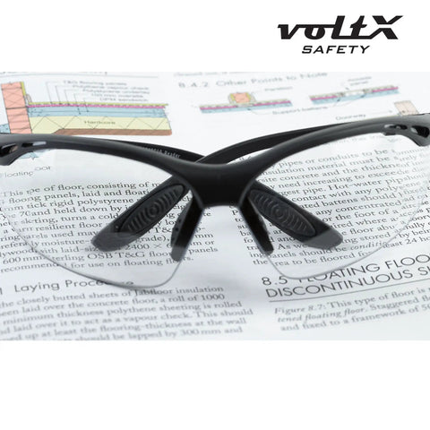 Constructor Full Lens Safety Reading Glasses With Wraparound Frame placed on open book.