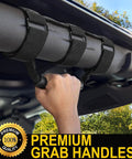 Two Pack Grab Handle Set for Jeep Wrangler TJ YJ JK 1955 to 2023, black handles with three-strap fit on roll bar, hand gripping handle.