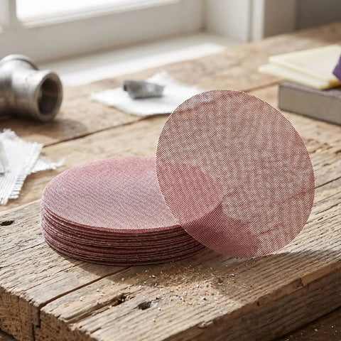 Super Cool 5 inch Mesh Sanding Discs With Hook And Loop Backing, 240 Grit Fine Aluminum Oxide For Wood and Metal Project Dust Free Set of 50 in stack on wooden surface.