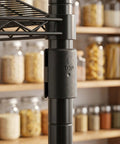 Close-up of 32 Pack Wire Shelf Clips With Plastic Locking Connectors securing wire shelving post in kitchen storage.