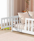 Full Size Floor Bed With Fence And Door For Toddlers And Kids, safe guardrails, wooden platform bed with white finish, side view