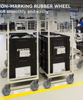 5 Inch Non Marking Rubber Caster Wheels With 3/8 Inch Bore Axle Heavy Duty Cart Rollers on a cart moving in a clean workspace.