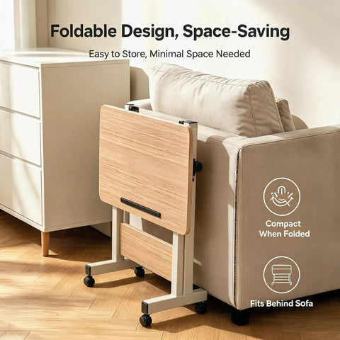 Rolling Laptop Standing Desk With Adjustable Tilting Tabletop And Smooth Locking Casters Lightweight Foldable Computer Workstation For Lowkey Work From Home Vibes In Compact Dorm Or Apartment Spaces folded beside a sofa.