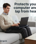 Person using a 17 Inch Dual Fan Laptop Chill Mat With Soft Neoprene Surface on sofa, designed for cooling and comfort with USB A power.