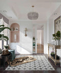 Stylish hallway with patterned floor tile, wall decor, and a home sweet home doormat