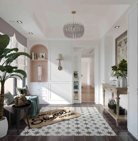 Stylish hallway with patterned floor tile, wall decor, and a home sweet home doormat