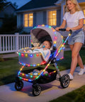 Stroller decorated with 2 Pack Battery Operated Outdoor String Lights With 8 Modes, in a nighttime setting on a sidewalk.