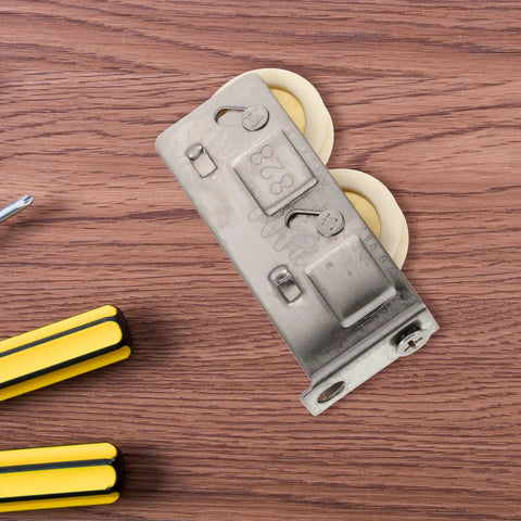 Heavy Duty Stainless Steel Track Roller That Glides Like Butter For Sliding Door Replacement Wheel And Window Pulley Hardware Kit Built Tough Premium Nylon Core Bearing 22mm Size on wood background with tools.