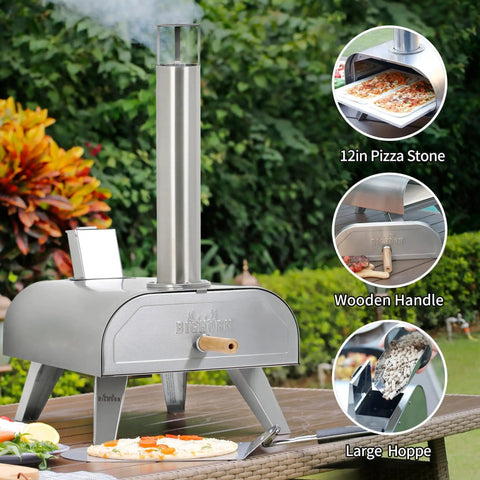 12-Inch Multi-Fuel Outdoor Pizza Oven with stainless steel body and wooden handle, installed on outdoor table in backyard setting.