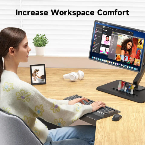 17 Inch Black Corner Desk Extender For L Shaped Workstations visible on a wooden desk with a monitor and keyboard setup.