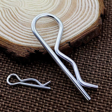 Close-up of heavy duty stainless steel roll pin and cotter pin from 30 piece assortment for trailer hitches mowers trucks towing accessories.