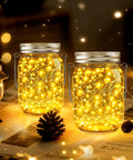 Mason Jar Solar Lights Set Of 12 With 30 LED Fairy Lights Warm White Outdoor String Lights displayed with glowing decor.