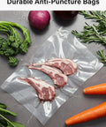 Vacuum-sealed lamb chops in BPA-free bag with fresh vegetables, part of 11 Inch By 150 Foot Vacuum Sealer Bags Roll With Cutter Dispenser.