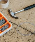 Premium Nickel Chromium Heating Element Replacement Strip for Heat Shrink Film Sealer alongside tools and screws on a work surface.