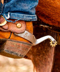 Rider wearing Stainless Steel Horse Spurs For Men And Women, Rustproof Boot Spurs With Brass Swing Buttons, on cowboy boots.