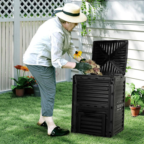 Person using 80 Gallon Outdoor Compost Bin With Top Flip Lid BPA Free Large Garden Composter For Kitchen And Yard Scraps Easy Assembly Sturdy Black Barrel Turns Waste Into Nutrient Rich Soil In Weeks