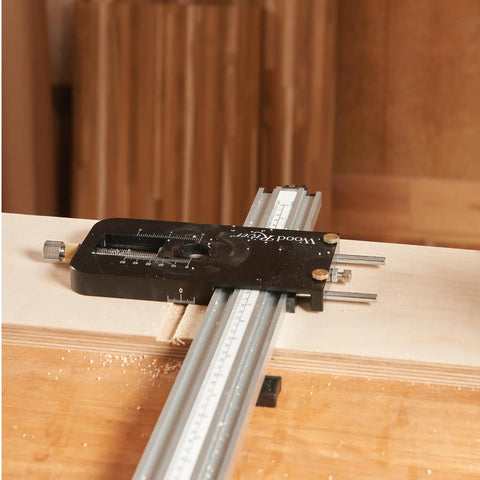 Top Shelf Router Dado Jig With CNC Machined Aluminum Carriage And One Inch Precision Bushing for precise cutting of wood slots.