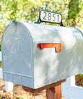 Mailbox with Black Double Sided Address Plaque Kit With 2 White Reflective Panels, 77 Vinyl Numbers, 12.68x4 size mounted on top.