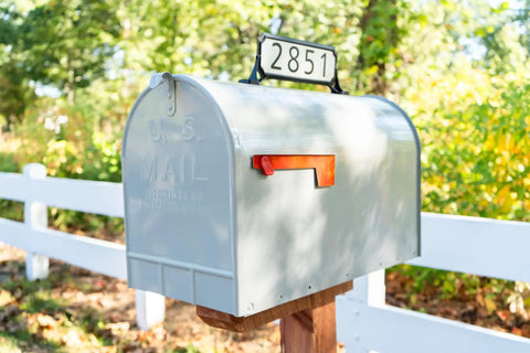 Mailbox with Black Double Sided Address Plaque Kit With 2 White Reflective Panels, 77 Vinyl Numbers, 12.68x4 size mounted on top.