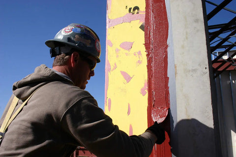 Construction worker applying FastFlash Fluid Applied Flashing Membrane for Windows Waterproof And Airtight Pro Grade Sealant.
