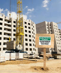 Construction site with OSHA Safety Sign Label Wear Safety Equipment Reminder 10 X 14 Inch 3 Mil Laminated Polyester Durable Sticker.