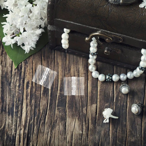 Slick All Purpose Acrylic Hinges For Jewelry Boxes And Crafts 10 Pack Small Piano Hinges on wooden surface with pearls