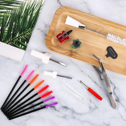 16 Piece Sewing Machine Cleaning Kit with dual head brush, tweezers, seam ripper, silicone brushes, and screwdrivers on marble.