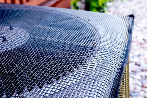 Close-up of AC Defender Full Mesh Outdoor Air Conditioner Cover For All Season Protection on a 37x37x40 inch unit.