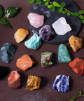 3 Pound Bulk Rough Madagascar Stones Mix including various natural raw crystals for tumbling and cabbing on a black surface