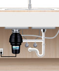 Designer Series 1-1/4 HP Food Waste Disposer with brushed nickel flange installed under kitchen sink.