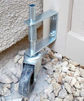 Beefed Up 4 Inch Gate Caster Wheel Set With Spring Loaded Swivel installed on wooden gate for mobility on rough ground