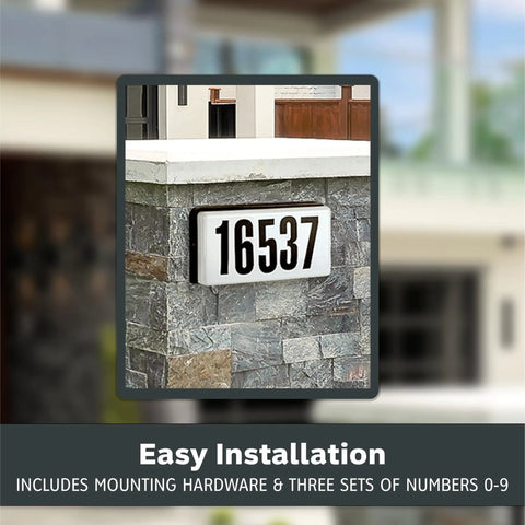 Lighted House Number Sign With 2 Backlit Bulbs Outdoor Address Plaque 10 Inch Black Wall Mount shown on stone wall near entrance