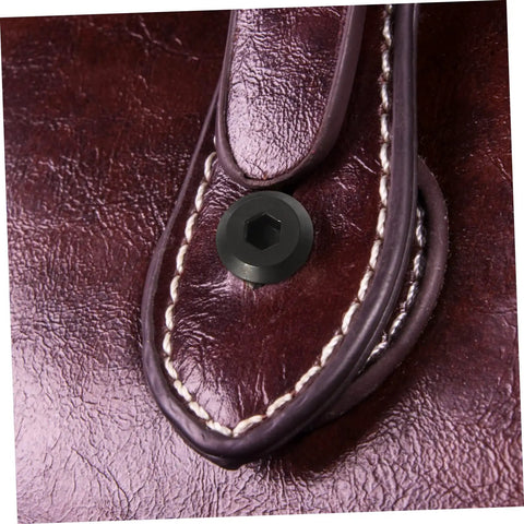 Black countersunk cap nut on leather with stitching, part of Premium Binding Screws And Countersunk Cap Nuts Designed For Hassle Free Install On Scrapbooks Photo Albums Files Craft Journals Hella Sturdy Fasteners Smooth Setup Top Tier Hardware.