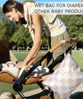 Woman with stroller using Waterproof Wet Dry Bags Set Of 2 For Swimwear And Baby Clothes Leakproof Reusable Pouches with zipper